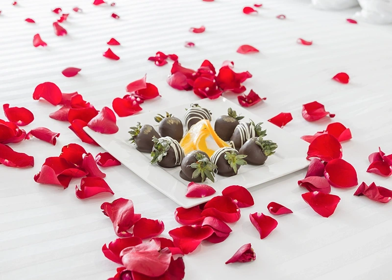 Inn at Spanish Head rose petals chocolate strawberries in room gift