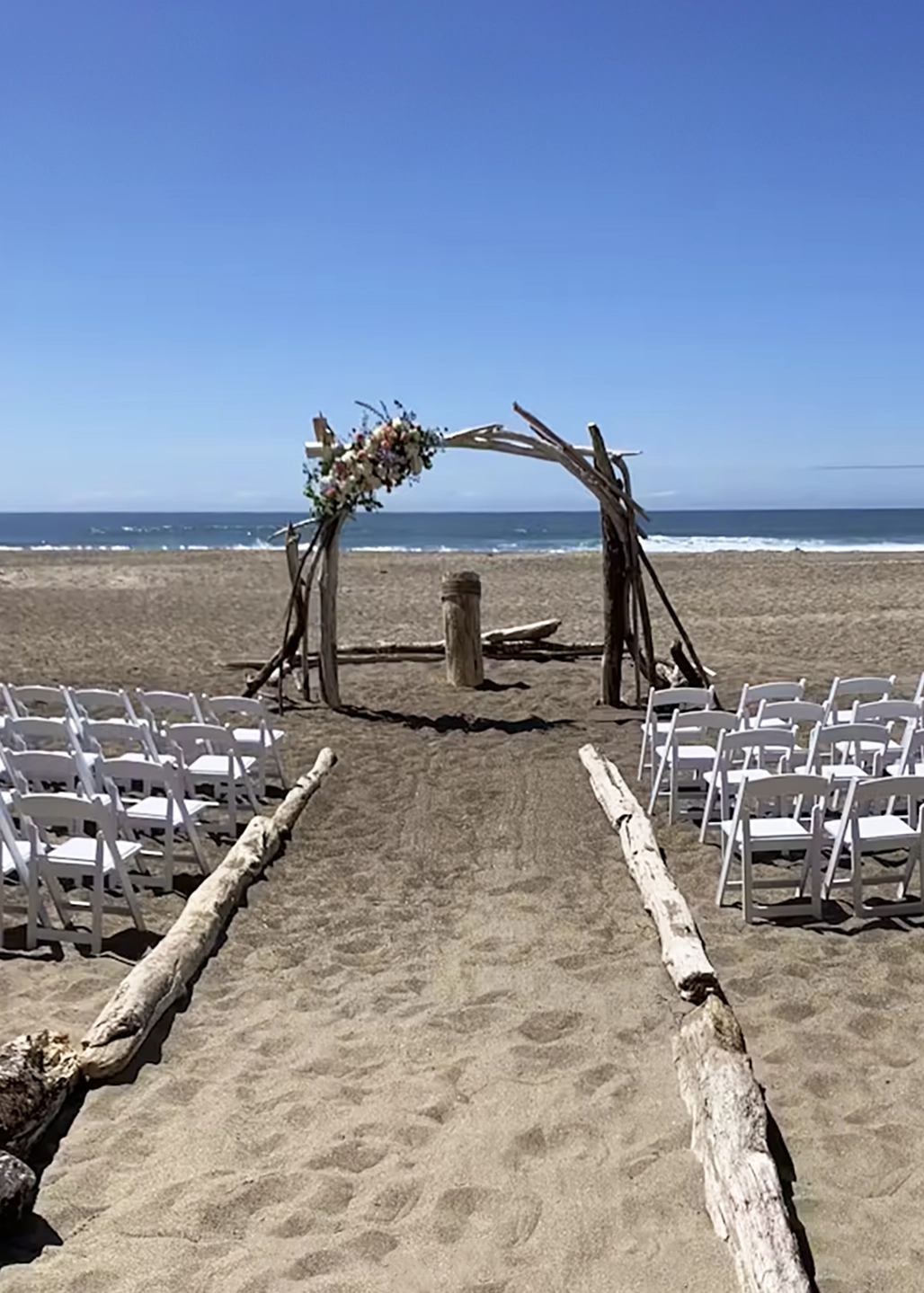 Inn at Spanish Head Wedding Ceremony on the Beach with Ocean Backdrop